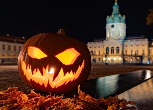 Glowing Jack-o'-Lantern in front of Charlottenburg Palace illuminates the night.